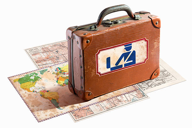 istock Antique leather suitcase with customs label on maps 468161615
