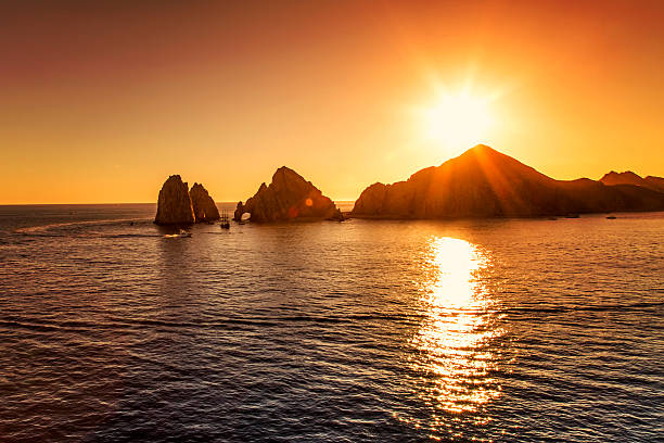 Cabo San Lucas sunset over Los Arcos in Cabo San Lucas cabo san lucas stock pictures, royalty-free photos & images
