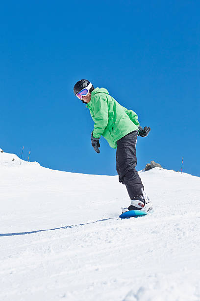 istock Man Snowboarding On Ski Holiday In Mountains 468162661