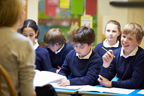 istock Teacher Teaching Lesson To Elementary School Pupils 468163291