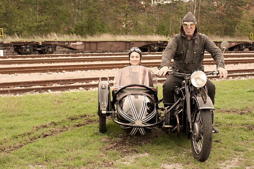 Road trip with a vintage motorcycle and sidecar. 
