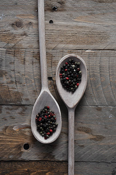 istock black pepper on the blade on a wooden background 468169110