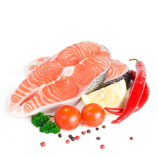 istock Salmon steak with lemon, pepper and parsley 468170857