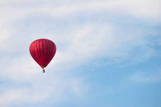 istock Red balloon in the blue sky 468172723