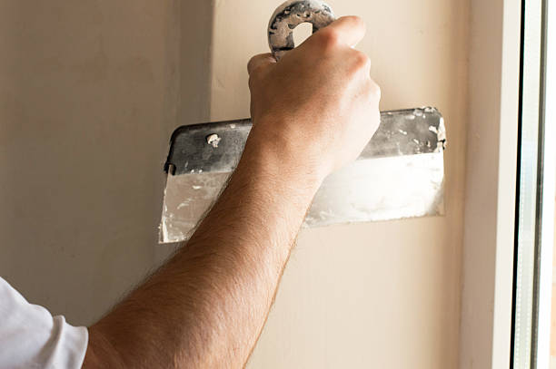 istock The process of applying the second layer of putty spatula 468172872