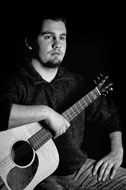 istock Young Musican with Guitar - Black White Image 468173166