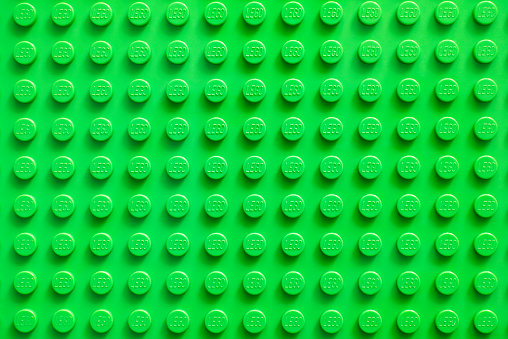 Tambov, Russian Federation - February 20, 2015: Lego green baseplate. Lego toys manufactured by the Lego Group (Billund, Denmark).