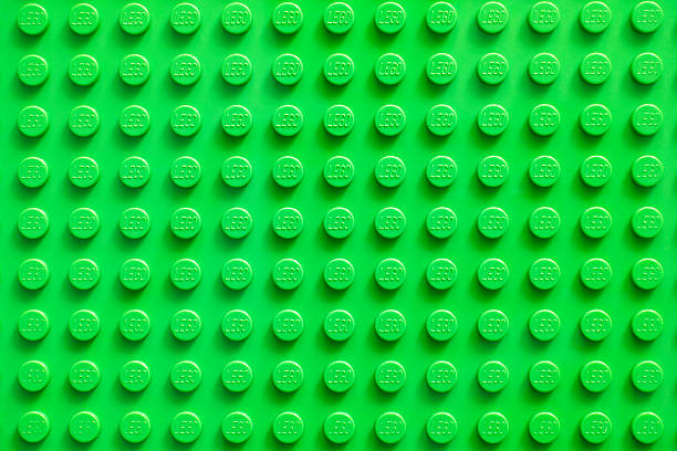 Lego green baseplate Tambov, Russian Federation - February 20, 2015: Lego green baseplate. Lego toys manufactured by the Lego Group (Billund, Denmark). lego stock pictures, royalty-free photos & images