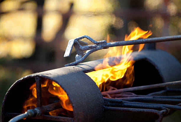 branding irons - brandmarken stock-fotos und bilder