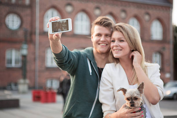 istock Young couple walking with their dog. 468176556