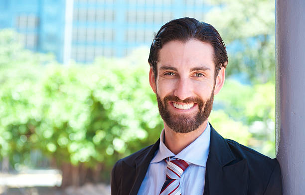 istock Handsome young businessman smiling outdoors 468176670