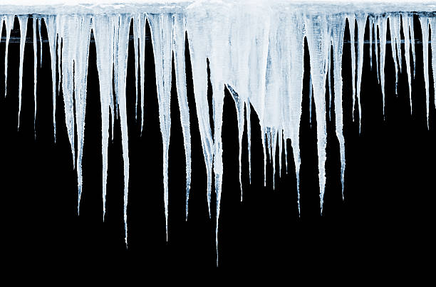 istock Group of icicles hanging on black background 468177927