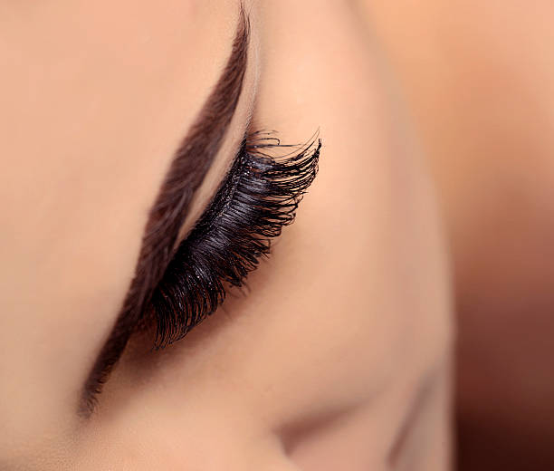 istock false eyelashes on woman eyes 468180578