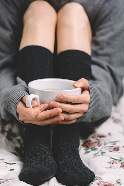 istock Cup of coffee in woman's hands 468182912