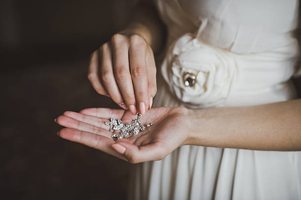 istock Earrings in hands of the bride 2085. 468187940