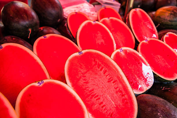 Watermelon being sold at the market in Chiang Rai, Thailand.