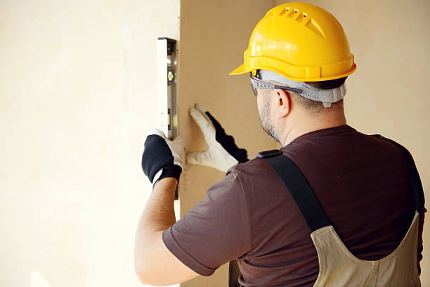 istock Male carpenter in working clothes in a construction workshop 468190458