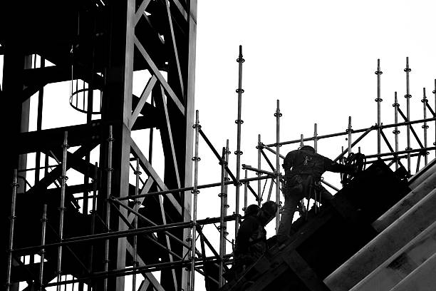 Abstract of a tall crane against clear sky