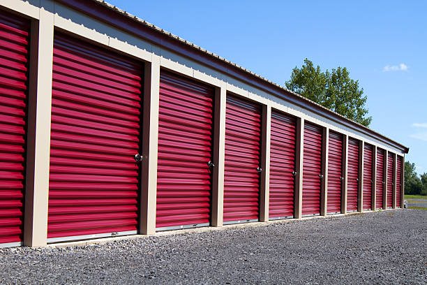 Mini Self Storage Rental Units A row of mini rental units for temporary self storage in an outdoor setting. storage compartment stock pictures, royalty-free photos & images
