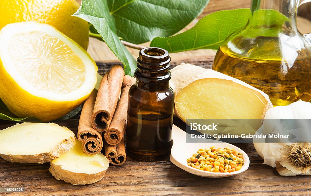 Alternative Medicine Alternative Medicine with Lemon Oil,Pollen,Cinnamon , Ginger and Garlic 2015 Stock Photo