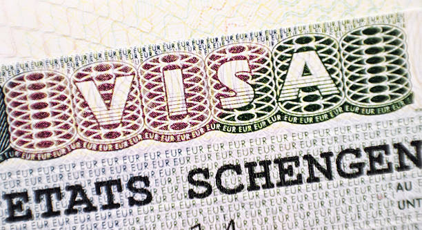 istock Close up Schengen visa in the passport 468196306