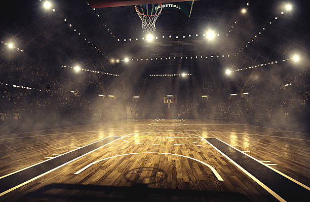 Basketball arena Indoor floodlit basketball arena full of spectators - full 3D sports court stock pictures, royalty-free photos & images