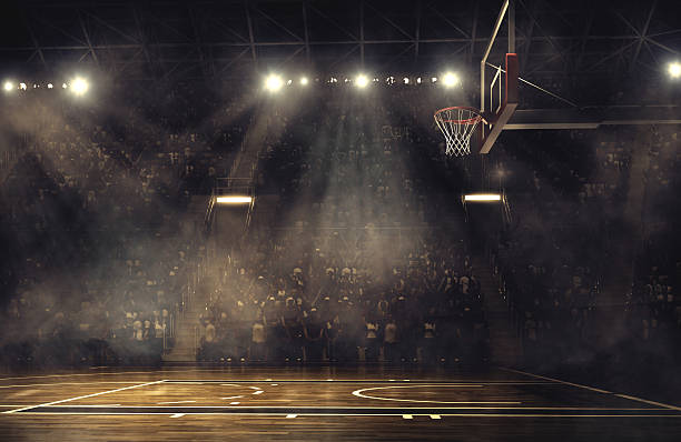 Basketball arena Indoor floodlit basketball arena full of spectators - full 3D basket stock pictures, royalty-free photos & images
