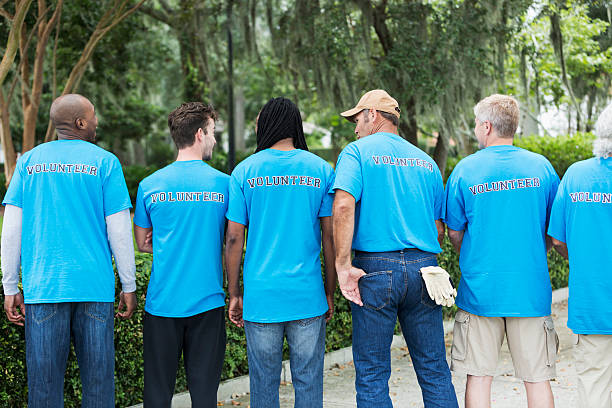 istock Group of men volunteering in a park 468196880