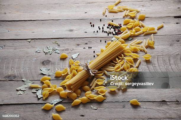 Cooking Concept Uncooked Italian Pasta Stock Photo - Download Image Now - 2015, Animal Nest, Black Background