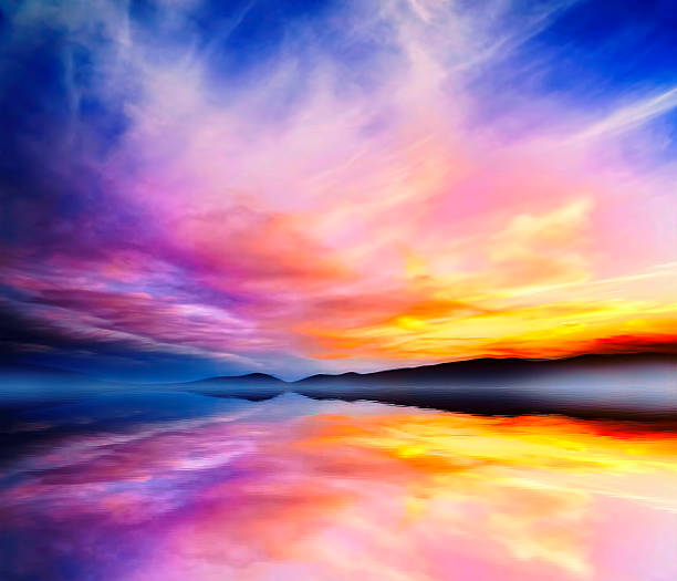 Sunset Colorful Dramatic Landscape.Mountains and Sky Water Reflection