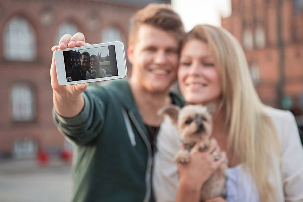 istock Young couple walking with their dog. 468202910