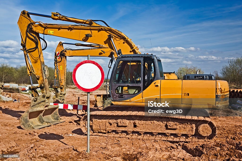 Yellow excavators in a new road construction 2015 Stock Photo