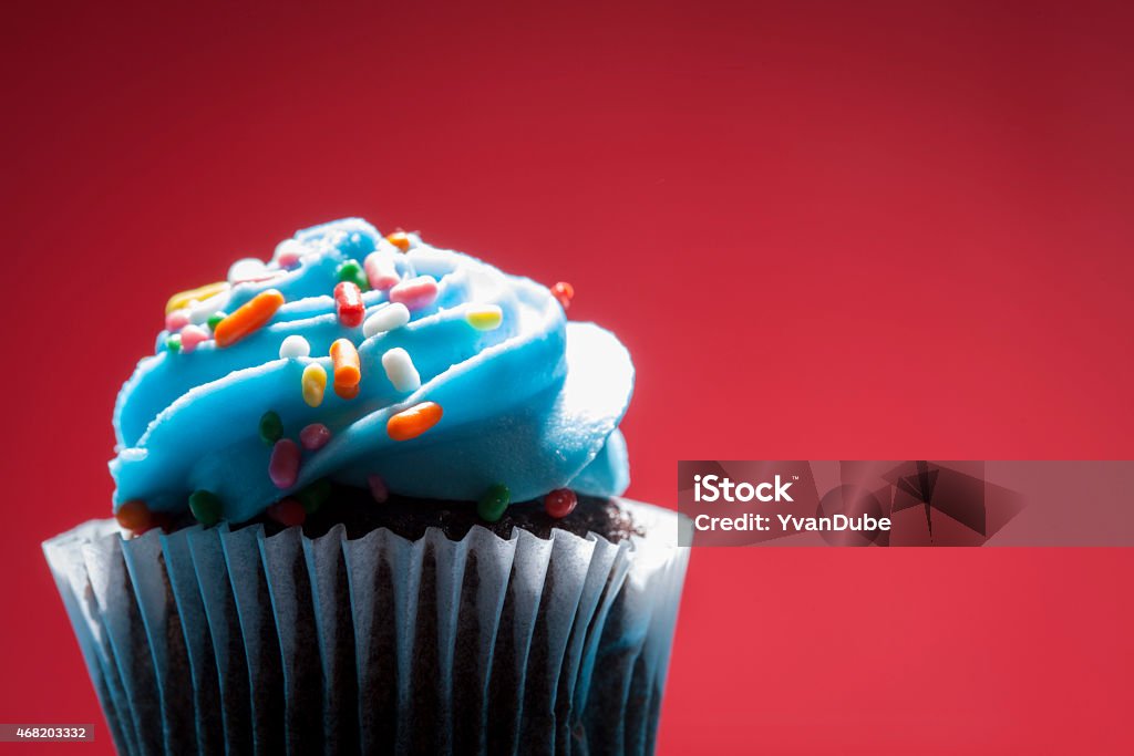 cupcake on red background A cupcake on a red background 2015 Stock Photo