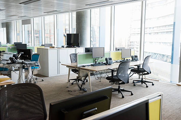 istock Modern brightly lit office with desks and chairs 468207844
