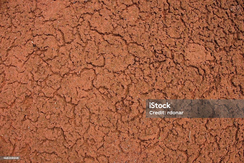 Old dry red crushed bricks surface on outdoor tennis ground. Old dry red crushed bricks surface on outdoor tennis ground. Detail of texture 2015 Stock Photo