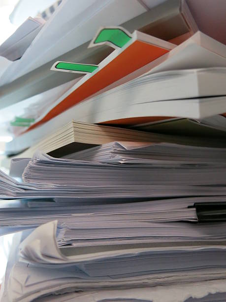 istock Pile of documents and books 468208710