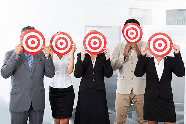 istock Businesspeople Holding Dartboard 468209013