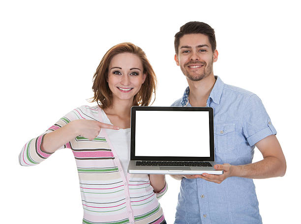 istock Young Couple Holding Laptop 468214625