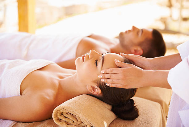 Best head massage Young couple enjoying a massage seaside spa massage stock pictures, royalty-free photos & images