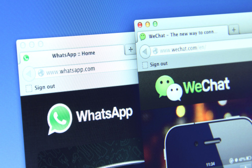 Johor, Malaysia - Dec 05, 2013: Photo of WhatsApp and WeChat on a monitor screen. They are famous instant messaging application for smartphones, Dec 05, 2013 in Johor, Malaysia.