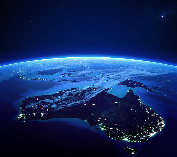 australia with city lights from space at night - australië stockfoto's en -beelden