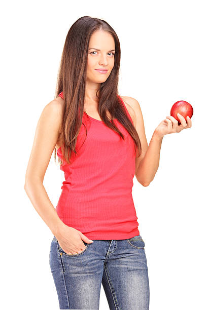 istock Beautiful young woman holding a red apple 468221099