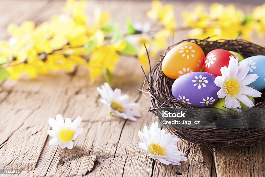 Easter eggs on wood Easter still life with traditional decorative eggs in nest Abundance Stock Photo