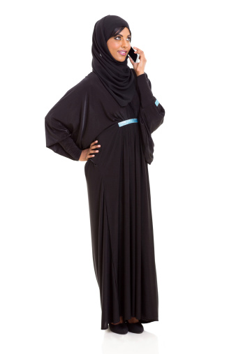 beautiful modern muslim woman talking on cell phone