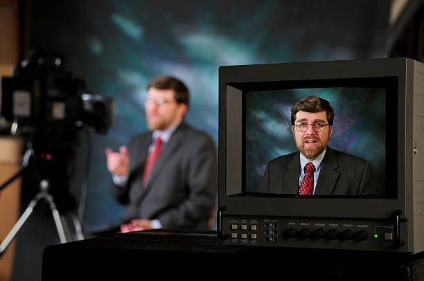 istock TV production studio showing man talking to camera 468222073