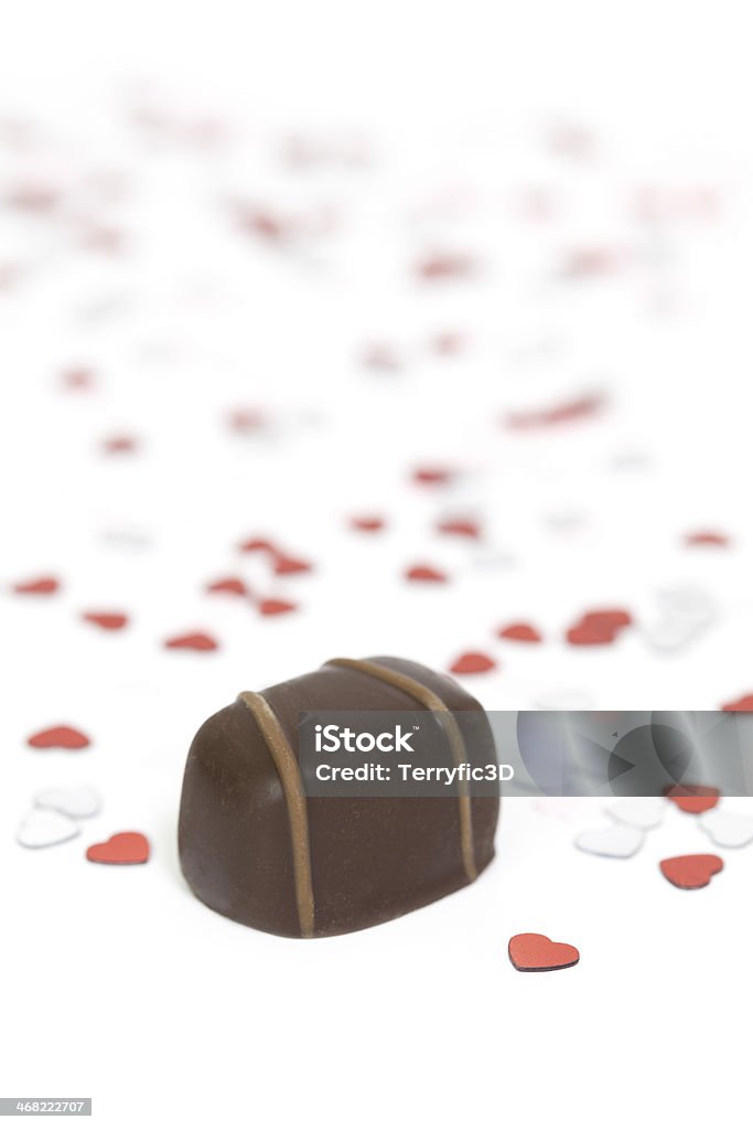 Valentine's Day Candy and Hearts Chocolates with heart shaped confetti Brown Stock Photo