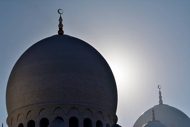 istock Mosque domes against the sun 468237840