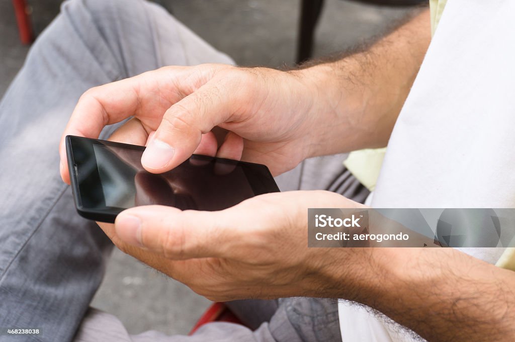 smartphone in hand 2015 Stock Photo