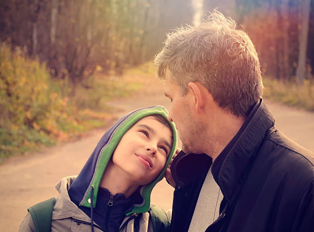 istock Father and son having talk outside  468241780