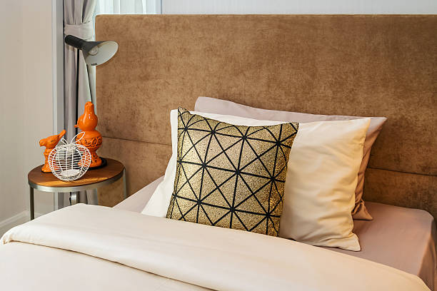 istock single bed with bedside tables and reading lamp 468244298